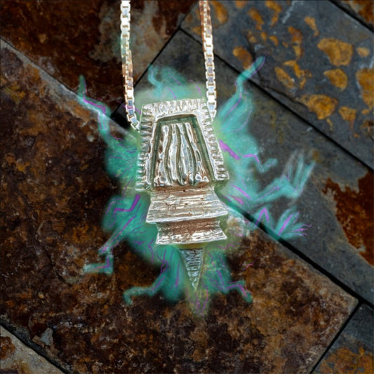 Pinnacle a sterling silver pendant, by Austin Kent Art surrounded by a blue glow, with purple lightning like veins emanating outward.
